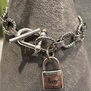 Nice stainless steel and silver tone live charm bracelet